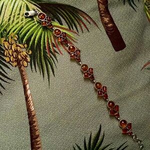 Vintage Delicate Bracelet appears to be silver and amber.
